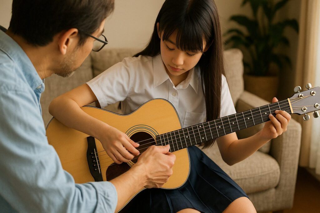 女の子が父親からギターを習っている